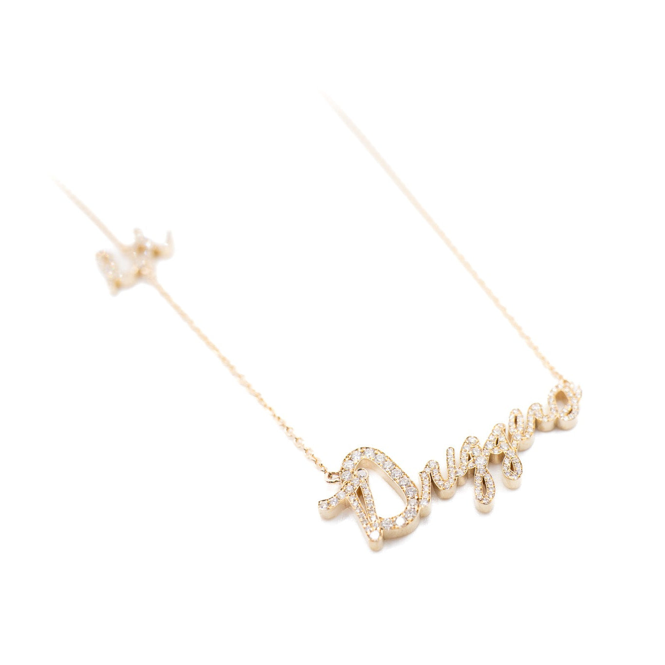 Gold necklace with a unique design on a white background